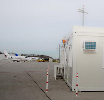 ELA containers on the apron at Salzburg Airport.